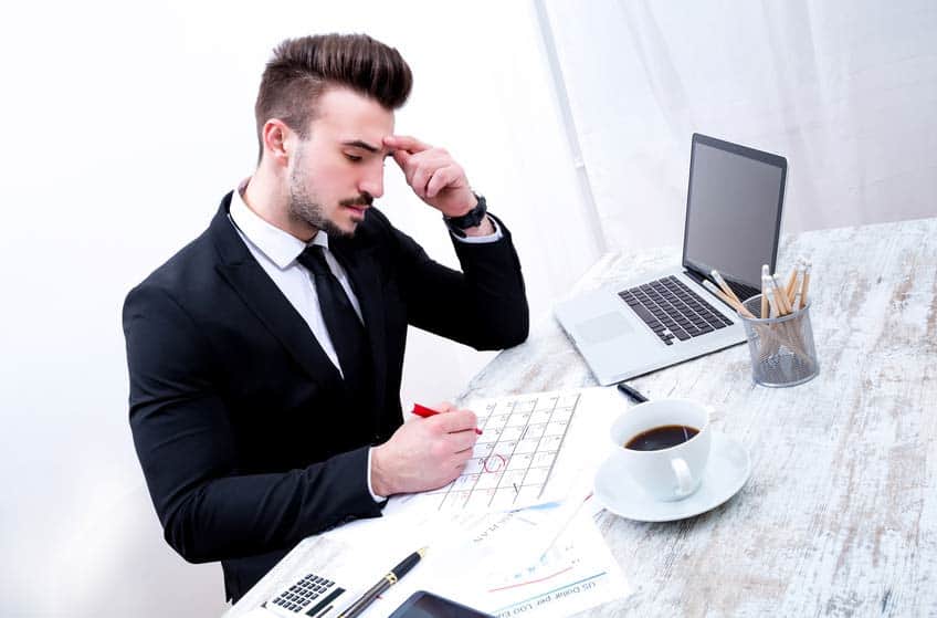 Advance Person checking the tour schedule in his office